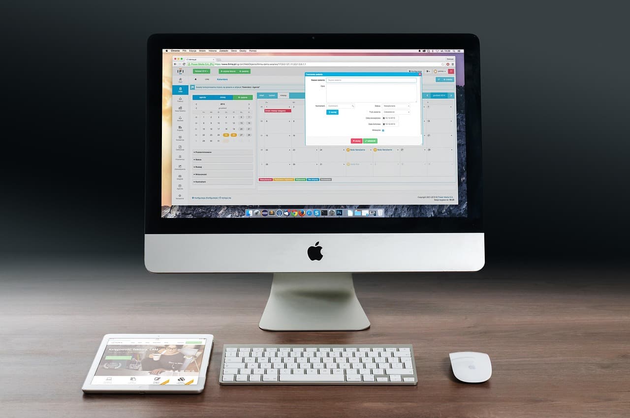 Computer monitor displaying a YouTube content calendar for channel planning and workflow management.