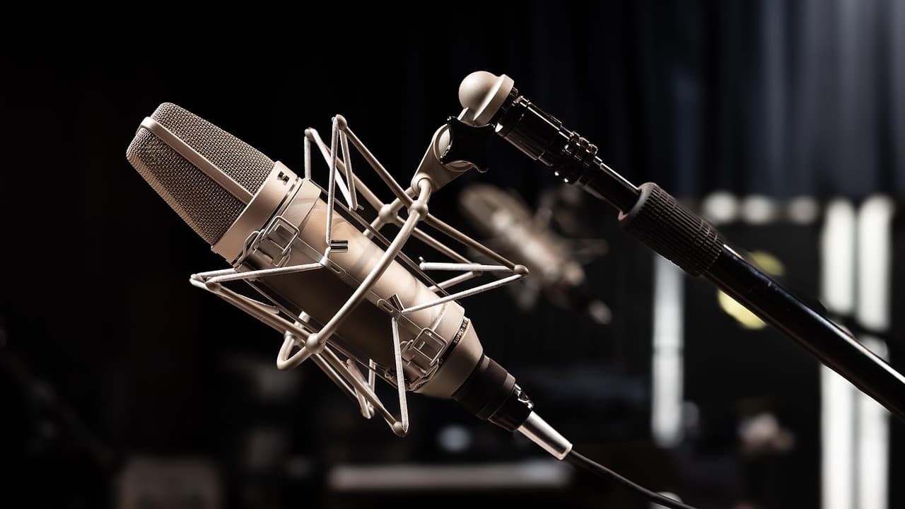 Close-up of a professional microphone on a shock mount, ideal for faceless YouTube audio production.