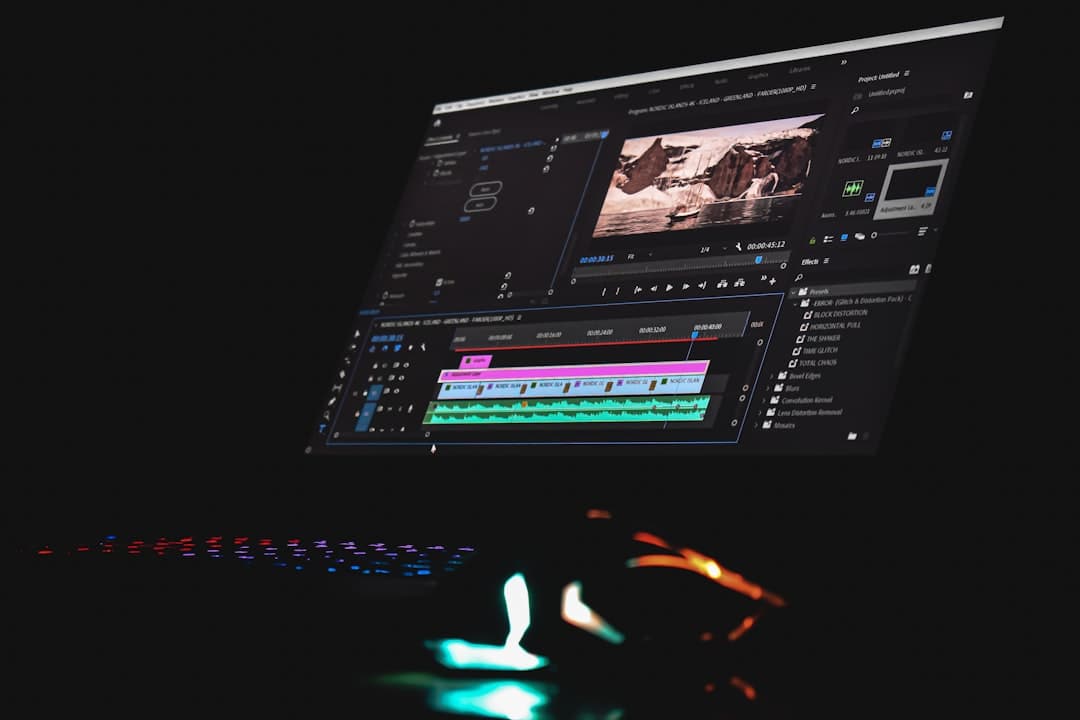 Video editing timeline on a computer monitor, showing audio waveforms and video clips for content creation.