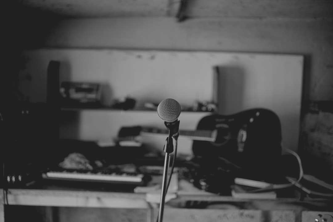 Microphone and audio equipment on a desk, suggesting a faceless YouTube creator's workspace.