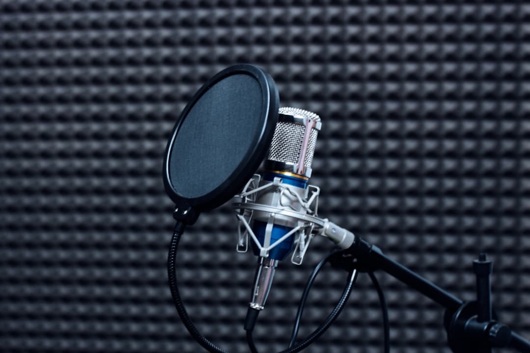 Microphone and pop filter in a soundproof studio, ideal for faceless YouTube content creation.