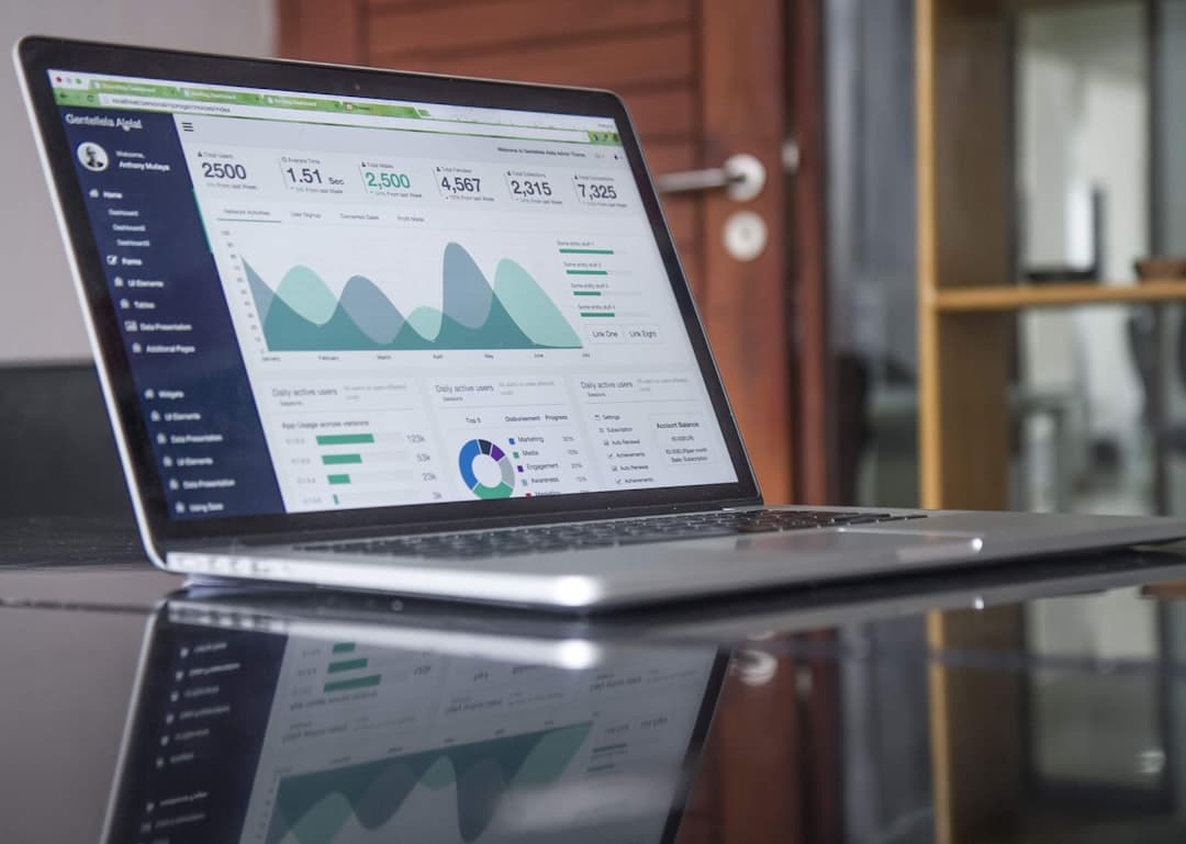 Laptop displaying YouTube analytics dashboard for content strategy and channel growth.