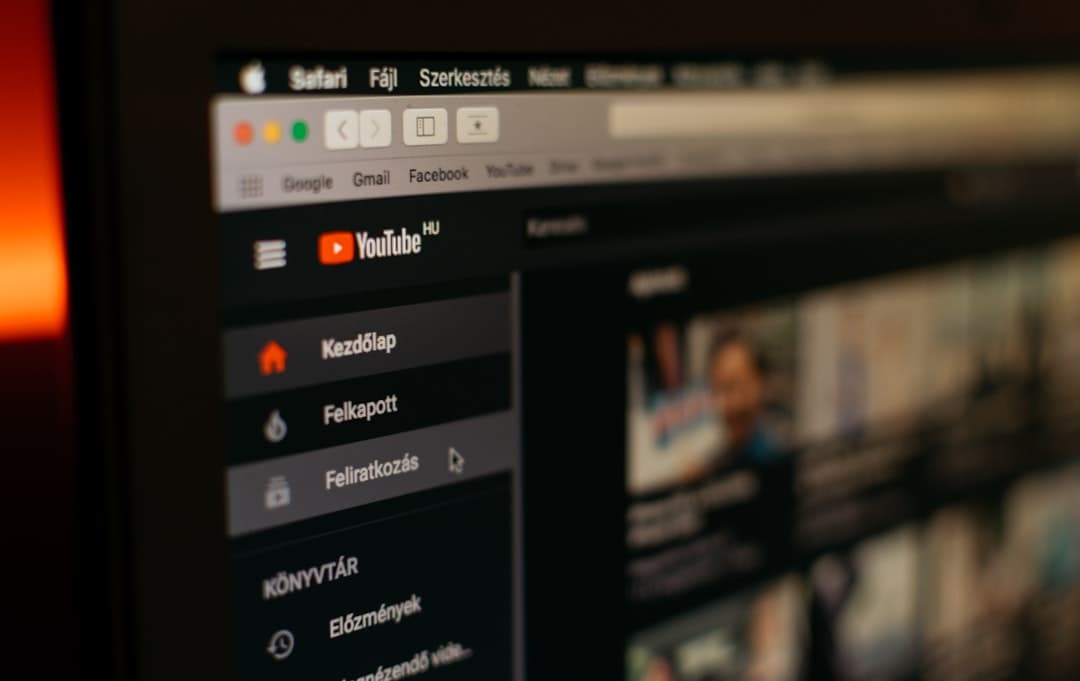 Close-up of YouTube channel page on a monitor, showing content and subscription options.